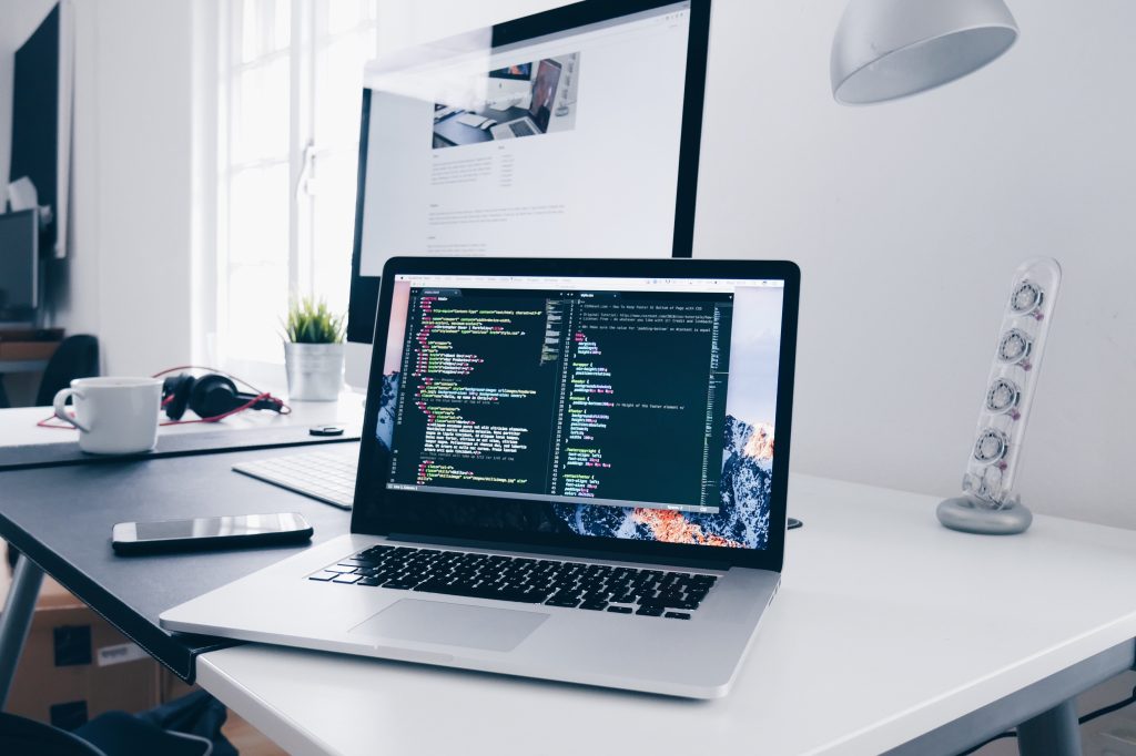 A mac computer setup showing code