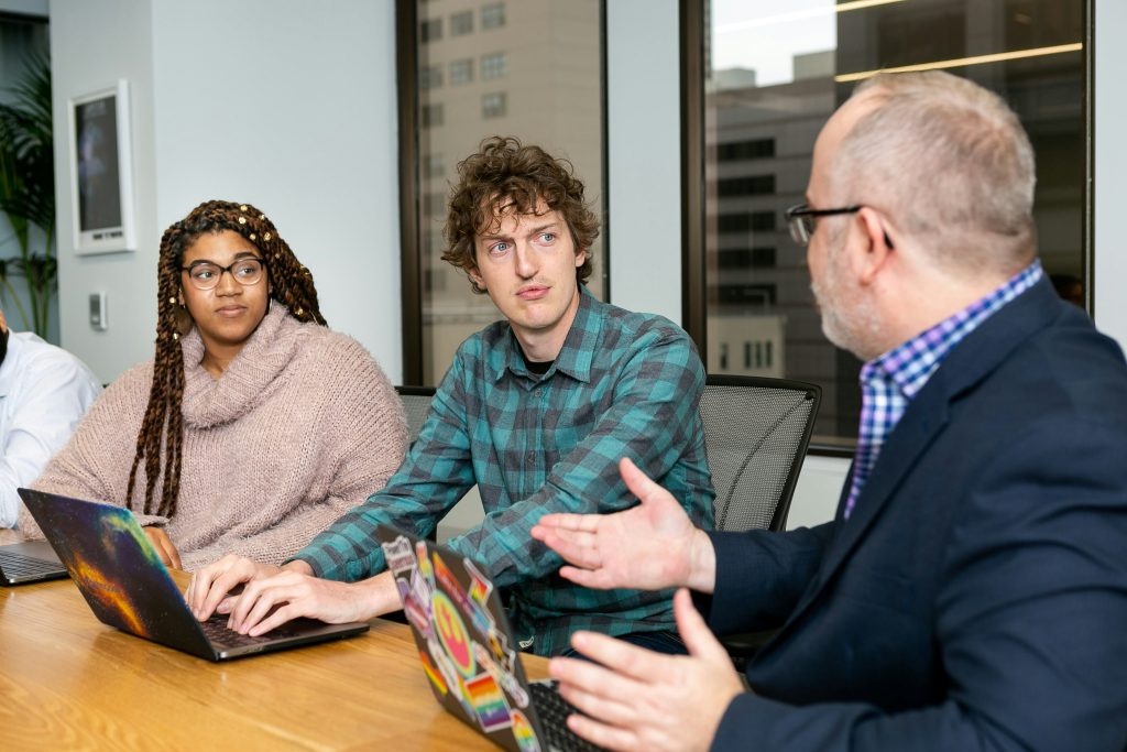 People in a meeting room discussing